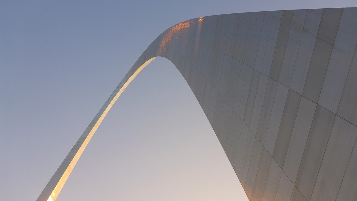 Morning sunlight reflects from the stainless steel curve of the Gateway Arch in St. Louis.